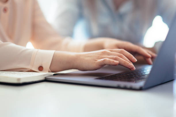 istock Hands of a girl working on a laptop 1162330344