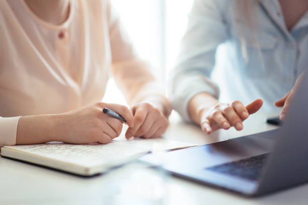 istock Hands of a girl working on a laptop 1162330355