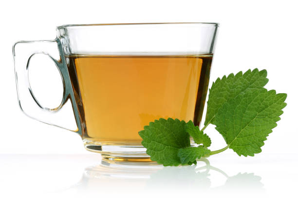 istock Melissa tea in a glass cup and green lemon balm 1162330442