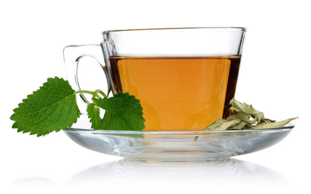istock Melissa tea in a glass cup and green lemon balm 1162330452