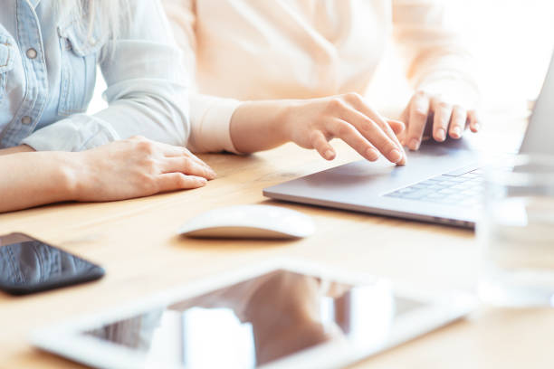 istock Hands of a girl working on a laptop 1162330457