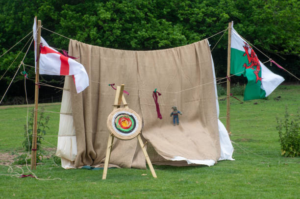 istock Medieval archery target board with welsh flag and george cross 1162330675