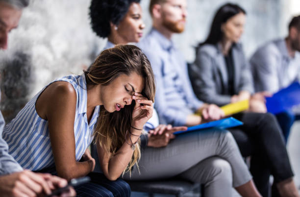 istock Young businesswoman having a headache while waiting for job interview. 1162335473