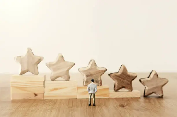 Photo of business concept image of setting a five star goal. increase rating or ranking, evaluation and classification idea