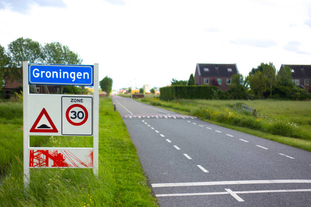 Groningen, Netherlands: A city limit sign for the city of Groningen, surrounded by grass and houses in the distance. The city is the capital of the eponymous province.