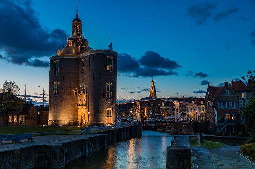 Historic Drommedaris Gate - city gate of Enkhuizen in the Netherlands, at blue hour - dusk