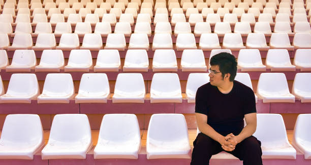 Football fan waiting for match time