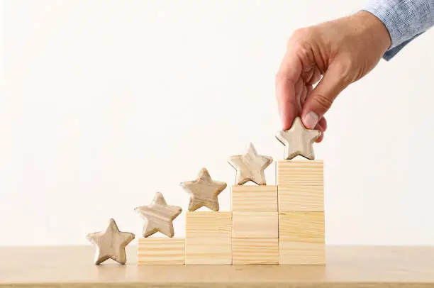 Photo of business concept image of setting a five star goal. increase rating or ranking, evaluation and classification idea