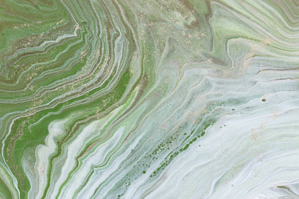 istock photography of abstract marbleized effect background. green and white creative colors. Beautiful paint 1162338377