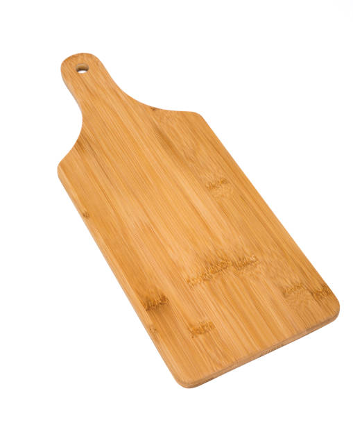 istock Wooden bread cutting board isolated on white, knife's cuts visible 1162341142