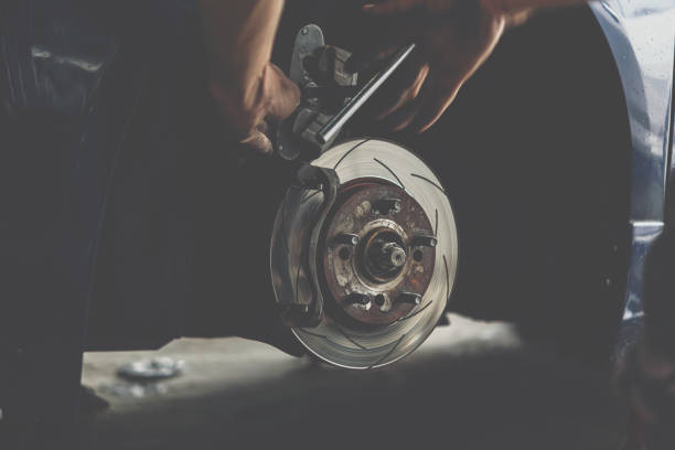 istock Disc brake and asbestos brake pads at car garage 1162341442