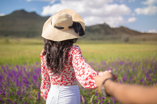 young woman in lavender flower field, beautiful summer landscape