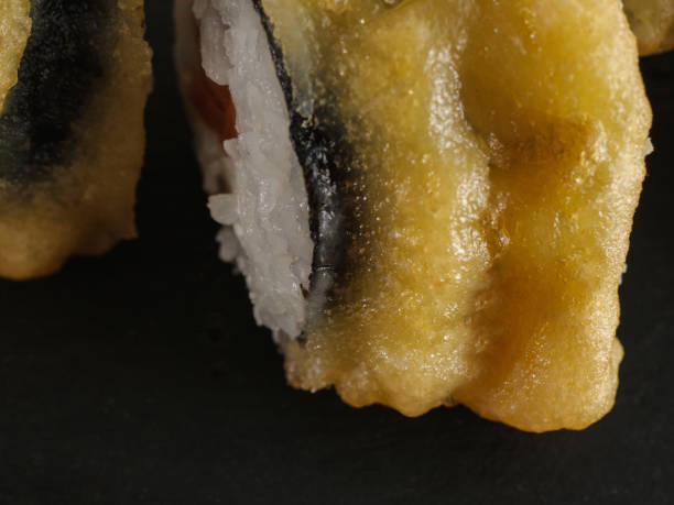 istock sushi rolls on gray stone slate on wood background 1162343014
