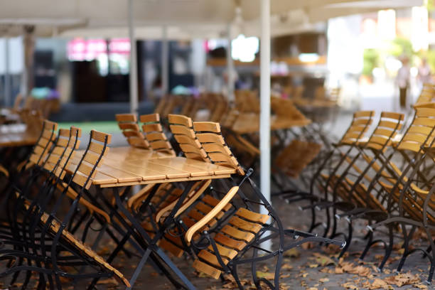 istock Empty outdoor cafe in old town Cologne, Germany 1162345102