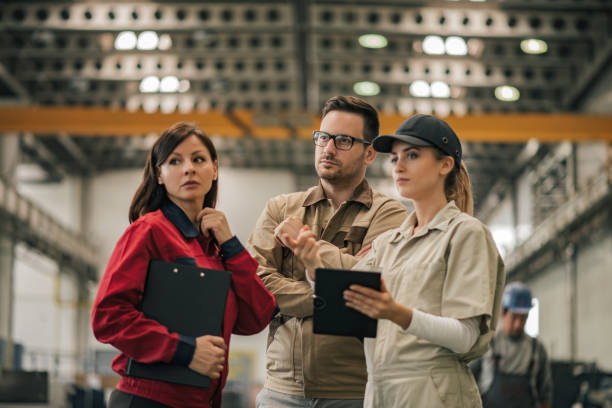 istock Business team discussing work at metal industry. 1162346484
