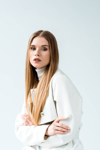 istock beautiful blonde young woman posing while looking at camera on white 1162347450