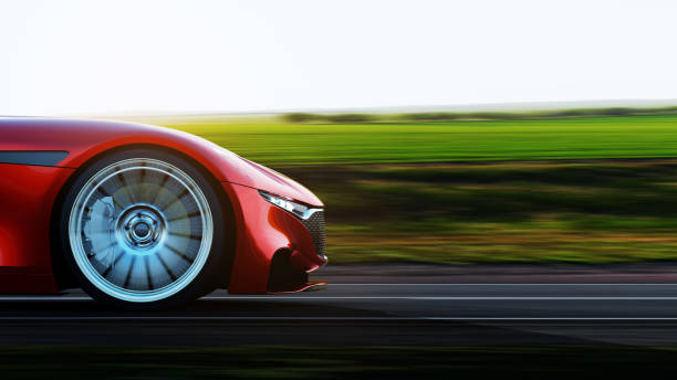 coche rojo que conduce en una carretera - performance car fotografías e imágenes de stock