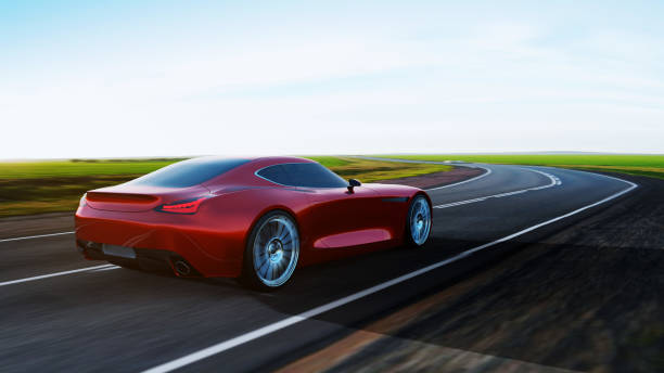 istock red car driving on a road 1162347978