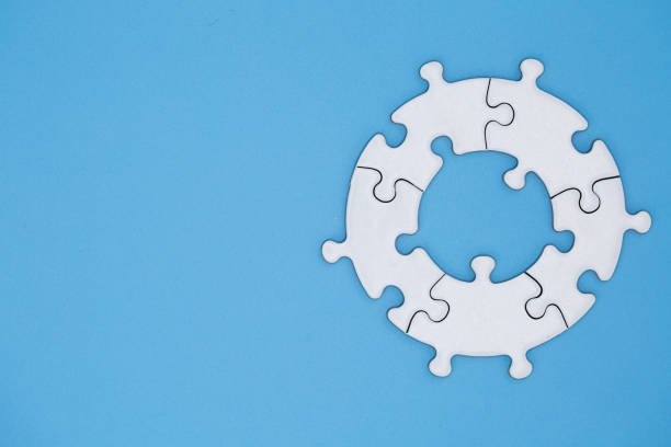 istock white jigsaw puzzle pieces on blue background,  Copy space. 1162348832