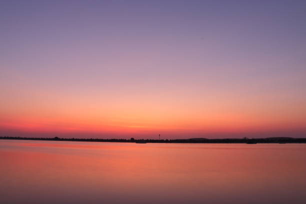 istock SUNSET VIEW FROM SEA SHORE - LONG EXPOSURE 1162350880