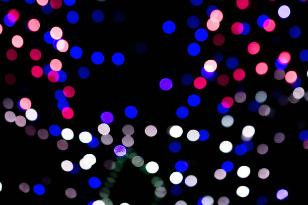 istock Unfocused abstract colourful bokeh on black background. defocused and blurred many round light 1162351906