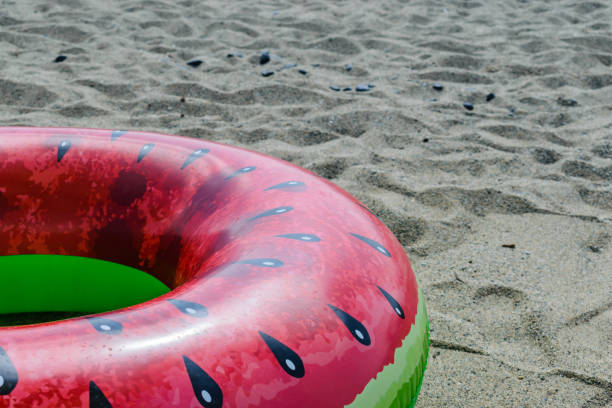 istock Watermelon swimming ring on a beach 1162351962