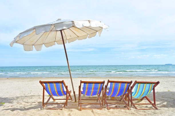 istock Tropical beach background as summer landscape with beach chairs 1162353080