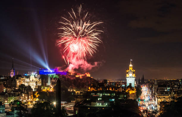 Fireworks over Edinburgh, Scotland Edinburgh, Scotland - A view over the historic city of Edinburgh, with fireworks marking the city's annual Festival. hogmanay photos stock pictures, royalty-free photos & images