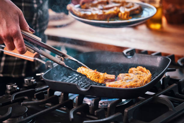 istock Roasting Lamb Chops in a Grill Cooking Pan 1162354513