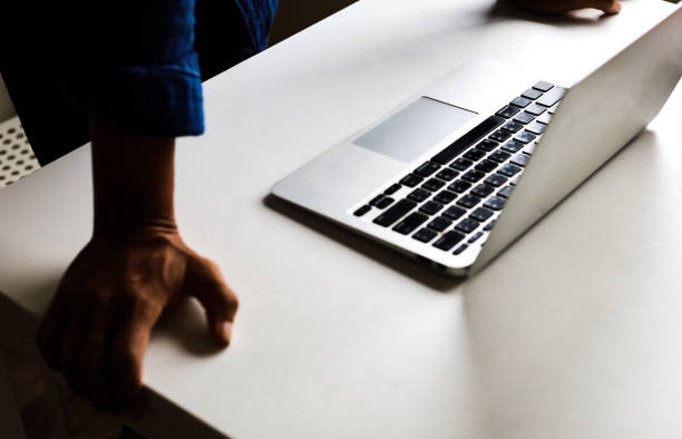 Close-up businessmen hands on laptop and creative job on table at homework.