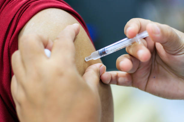 istock Nurse  making a vaccination to the shoulder of patient 1162357751