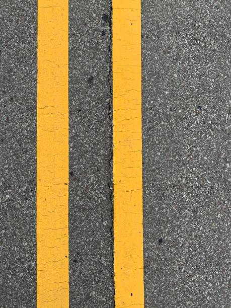 istock Double Yellow Line On Asphalt Street 1162358072