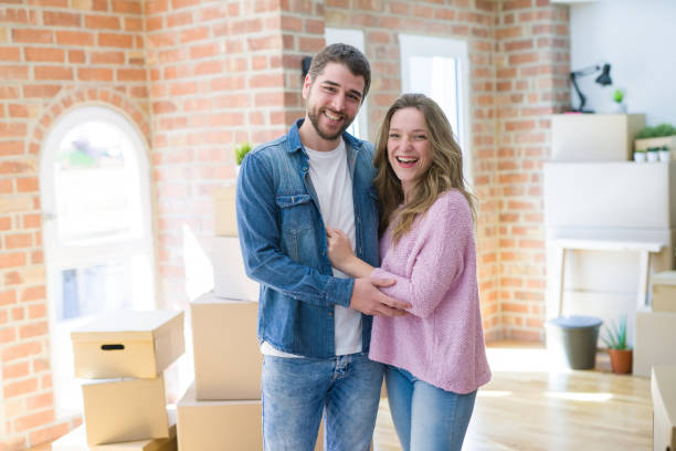 istock Young beautiful couple moving a new home 1162360662
