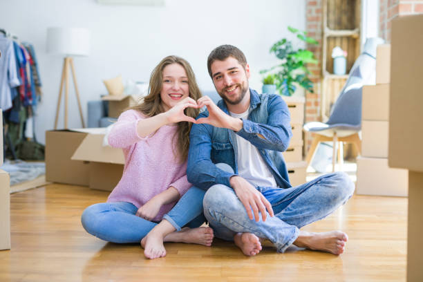 istock Young beautiful couple moving a new home 1162360702