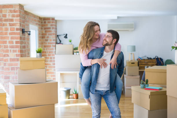 istock Young beautiful couple moving a new home 1162360783