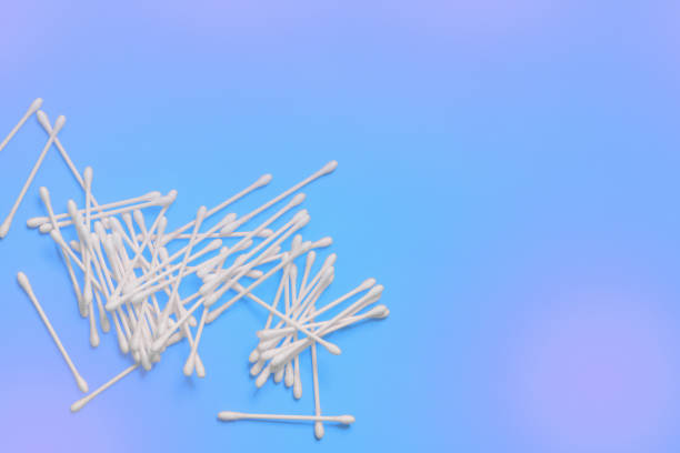 istock Ear sticks on blue purple background. Makeup removal and skin care concept. Space for text 1162360821