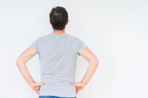 istock Handsome senior man over isolated background standing backwards looking away with arms on body 1162361070