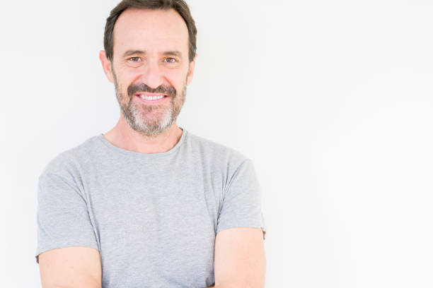 istock Handsome senior man over isolated background happy face smiling with crossed arms looking at the camera. Positive person. 1162361077
