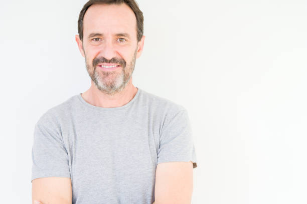 istock Handsome senior man over isolated background with serious expression on face. Simple and natural looking at the camera. 1162361082