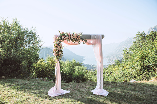 Beautiful wedding arch with flowers