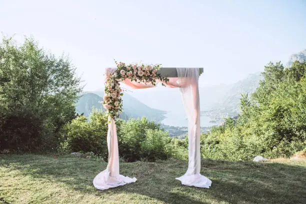 Photo of Beautiful wedding arch with flowers
