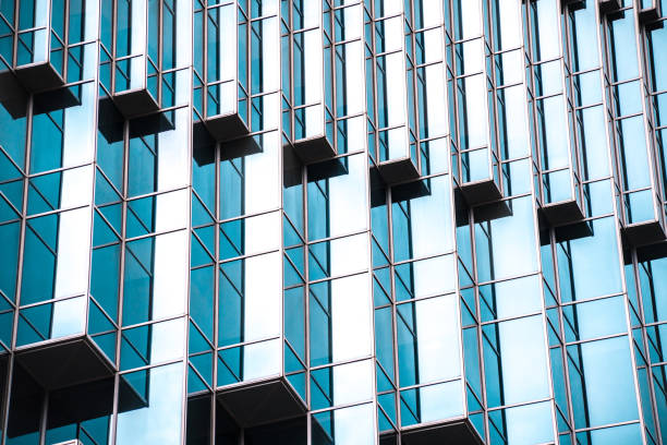 istock underside panoramic and perspective view to steel blue glass high rise building skyscrapers, business concept of successful industrial architecture 1162364509
