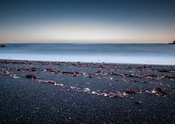 istock Creative long-term exposure with a view from the beach over the sea 1162365763