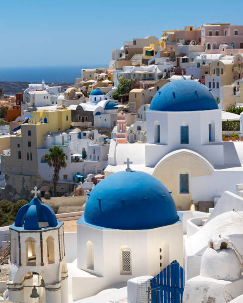 istock Iconic blue domes and hillside coastline at Oia Santorini 1162370510