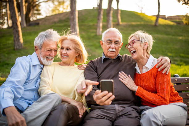 istock Group of seniors using mobile phone 1162370541