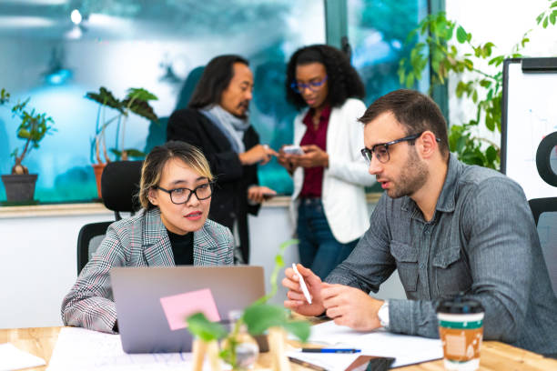 istock Multi-ethnic group of coworkers in the office 1162371392