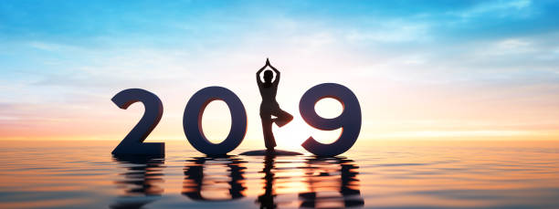 istock Yoga at the sea at sunrise 1162371639