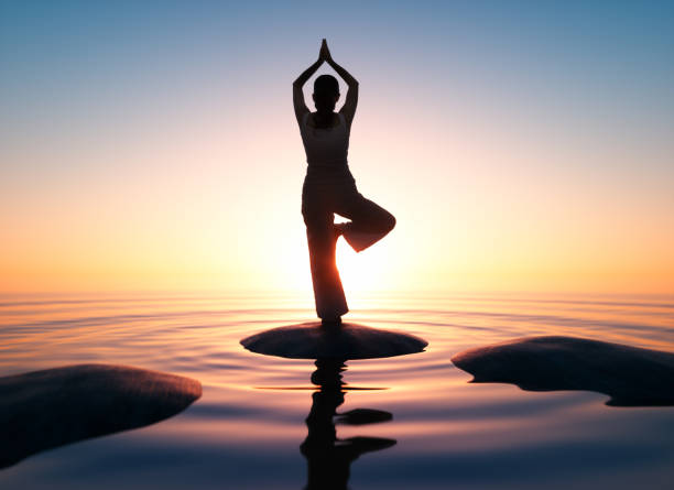 istock Yoga at the sea at sunrise 1162372279