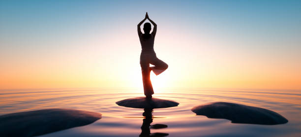 istock Yoga at the sea at sunrise 1162372286
