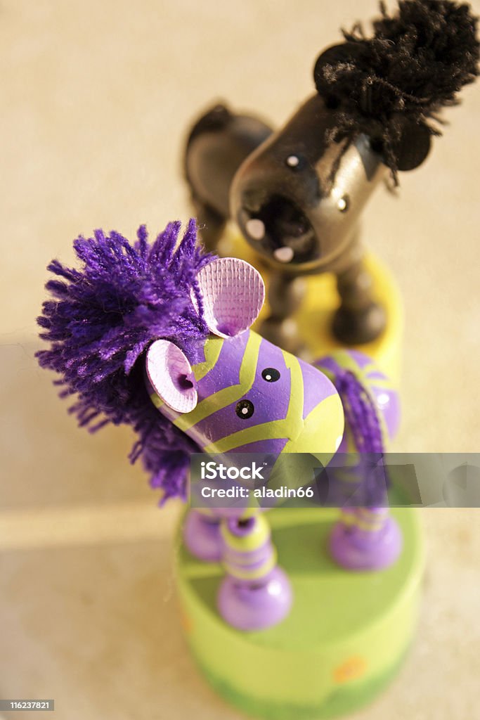 Wooden toys Wooden zebra and horse toys (focus on zebra head) Animal Stock Photo